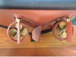 The Kort nozzles and rudder posts are ready installed. The brass propellers and cast rudders are also supplied.